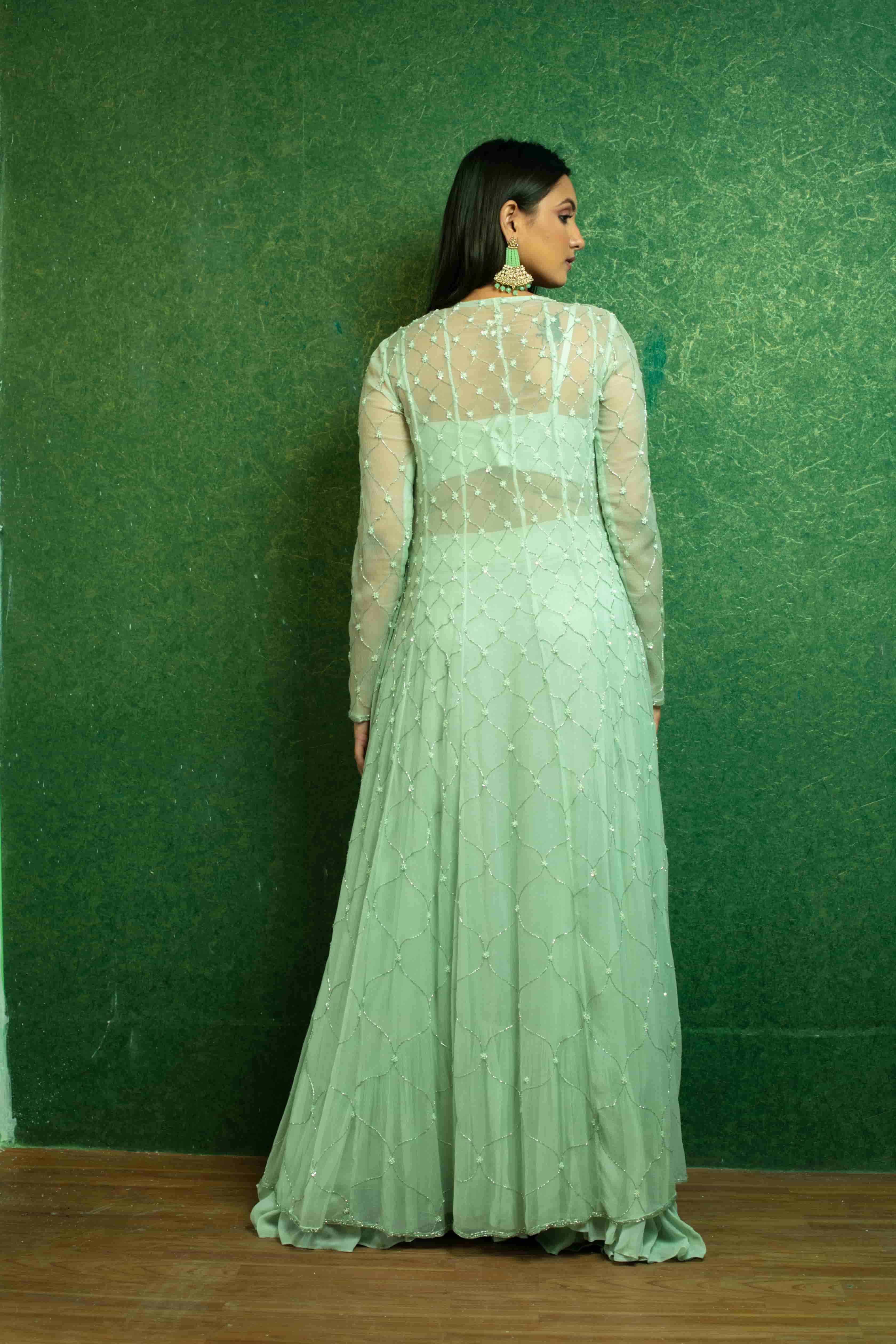 Aqua green georgette sharara and bustier lyered up with georgette embrioded jacket